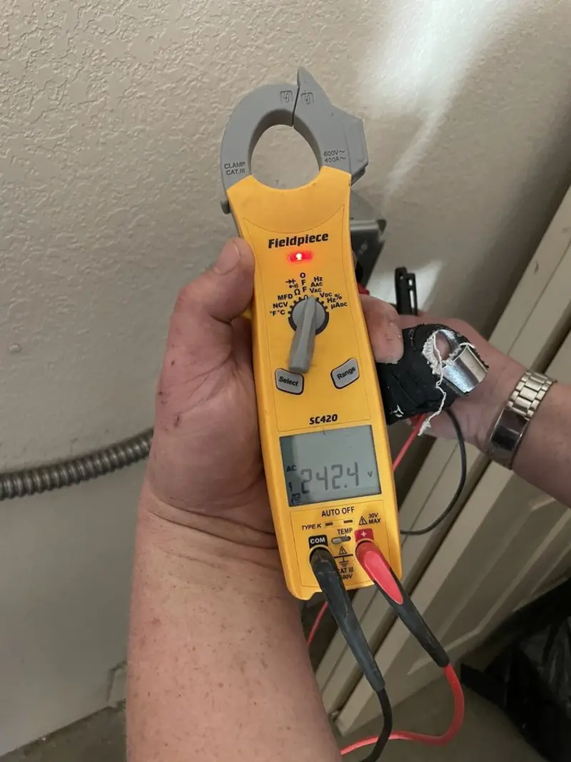 Voltage testing with clamp meter during Generator Installation in Englewood